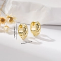 Macro detail of gold quilted hoop earrings with dimensions 1.1cm by 0.45cm - EH784 Gold Small Quilted Hoops