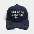 Detailed white embroidery on a navy and white mesh trucker hat with decorative stitching - Navy Blue + White Mesh