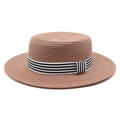 Close-up of a woven straw boater hat featuring a stylish black and white striped ribbon - M (56-58cm) / Dusty Pink