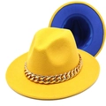Detail of yellow fedora hat with a bold gold acrylic chain and blue interior lining - Yellow and Royal Blue