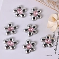 Detail showing 25x27mm silver metal flower charms with pink center gemstones - Pink Diamond Five-Petal Flower