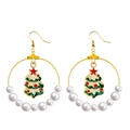 Detailed view of Christmas tree pendants and pearls on large golden hoop earrings - Pearl Hoop with Christmas Tree
