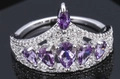 Elegant silver crown ring featuring purple drop-shaped cubic zirconia on a black surface - Ur0593d