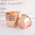 Rose gold aluminum foil cupcake liners in a stacked arrangement for baking muffins - Double-sided Champagne Gold