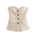 Detail view of the cream white strapless vest top with four dark buttons and pockets - XS / Cream White Top