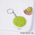 Green realistic round cookie keychain pendant with textured surface and silver keyring - Matcha Green Round Cookie - Keychain