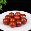 Red jasper crystal spheres set on white plate, natural stone decor balls with unique texture - Red Jasper