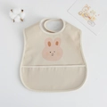 Waterproof baby bib with pink rabbit print and crumb catcher pocket in beige - Pu Bib (double-layered Pocket) - Pink Momo Rabbit / One Size