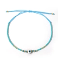 Bracciale boho azzurro con occhio del male, cordoncino intrecciato regolabile e perline d'oro - Azzurro