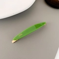 Pinza de pelo verde de acetato con clip de metal dorado y letras Paris sobre fondo gris - Verde Ovalado