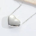 Detailed view of a silver minimalist heart pendant with a fine link chain necklace - Flat Heart / Silver