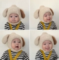 Beige plush baby earflap hat with brown ear accents and warm lamb wool texture - Cap circumference 40-48cm, suitable for 3-18 months / Plush Dog Beige