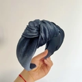 Detailed view of dark grey knotted wide headband with textured diagonal woven fabric - Gray