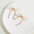 Elegant 14K gold plated bow earrings with a textured ribbon design and secure clear backs - Medium-Short Style / Gold