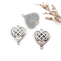 Macro detail of silver heart Celtic knot alloy charms with dual hanging loops on white - 1Pc Heart Celtic Knot 24x27mm