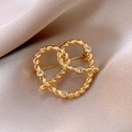 Detailed macro view of a 14k gold plated twisted knot brooch with sparkling crystals - 4# Gold - Heart