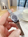 Close-up of a silver oval quartz watch for women with a black dial and metal link strap - Silver Band Black Dial