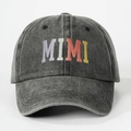 Close-up of MIMI embroidery and washed cotton texture on distressed baseball cap - One Size / Black