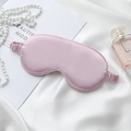Pink satin sleeping mask on white silk background with pearls and perfume accents - Taro Purple Eye Mask