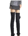 Detail of black cable knit over-knee leg warmers with fuzzy pom-poms on long socks - One Size / Black