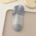 Japanese style gray and white striped low-cut cotton boat socks for women on a tray - One Size / Fog Purple