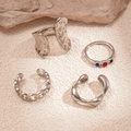 Close-up of four silver metal rings with rhinestones and textured geometric designs - Silver (5-Piece Set)