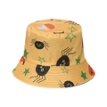 Detail of yellow bucket hat with spider, green stars, and potion bottle patterns - Yellow