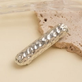 Close-up of a silver hammered metal hair clip on a natural stone background - Hammered Bar Hair Clip / Silver