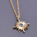 Gold star pendant necklace featuring a central blue gemstone on a fine link chain - Necklace Set / Gold