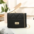 Classic black crossbody bag with geometric triangle stitching and gold chain strap - Black