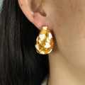 Golden teardrop earrings with white heart enamel pattern worn by female model - Heart Pattern Waterdrop Style (EH123 White Pair) / White
