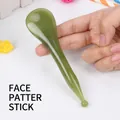 Green resin facial massage tool with round point and spatula ends for face lifting - Facial Tapping Stick / Green