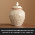 Ceramic tea canister with relief rabbit and floral pattern in a grass wood ash glaze - Straw Ash Relief Golden Osmanthus Moon Rabbit - Jar
