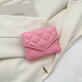 Pink quilted envelope card holder with diamond stitching on beige fabric background - Pink