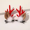 Detail of Christmas reindeer antler hair clips with red flocking and white fur pom-poms - Christmas Antler Hair Clips - White Pom Red