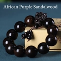Gros plan du bracelet en bois de santal noir avec tête de dragon sculptée et gourde - Ébène du Mozambique (20200604)