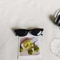 Classic square black sunglasses with resin frame and dark lenses on a graphic card - Black and Gray