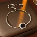 Detail of adjustable silver bracelet featuring a large oval purple zircon and micro-pave - Silver-Purple