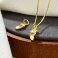 Golden necklace with baby footprint pendants featuring a pink cubic zirconia accent - Pink