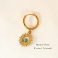 Detail view of gold hoop earrings with sunburst charms and teal beads on woven texture - Amazonite Sun