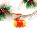 Détail de pince à cheveux chaussette de Noël en résine pailletée avec feuilles de houx - Botte de Noël Pailletée