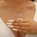Close-up of silver stainless steel MOM LOVE necklace and earrings set on model - MOM LOVE Letters-Steel Color