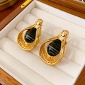 Detailed view of vintage gold-rimmed black teardrop earrings on a white jewelry cushion - Silver Pin - Black Agate Teardrop Stud Earrings (WE478)