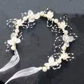 Detail of floral hairband featuring white silk flowers, pearls, and organza ribbons - Flower Garland Headpiece / White