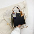 Chic black box bag with gold metal trim and printed silk scarf handle detail - Black