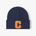 Navy blue winter beanie with orange towel-embroidered letter C patch on a grey background - Navy Blue