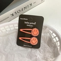 Pair of orange smiley face hair clips for girls displayed on a white background - [17] Smile Face - Orange