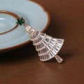 Macro shot of gold-tone Christmas tree brooch with emerald star and sparkling crystals - Style 45 (6*3cm)