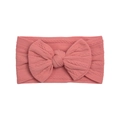 Close-up of coral pink nylon baby headband showing cable knit texture and large bow - Dark Mauve