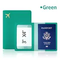 Green leather passport holder with gold airplane logo and clear card slot - Green